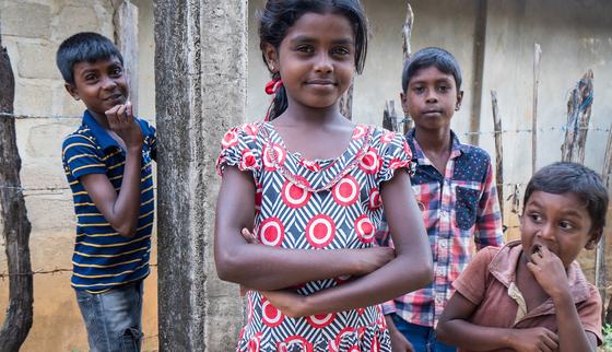 Sri Lankan girl with friends - smiling into camera_War Child Sri Lanka_200223