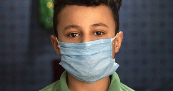 War Child Holland - Covid 19 - Corona response - boy with mask - zoomed in