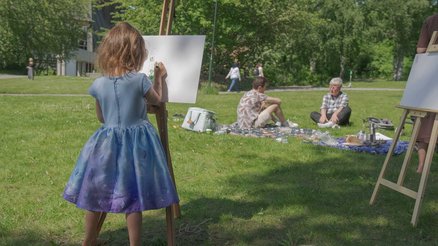 Girl painting during Peace of Art event in Stockholm